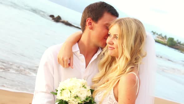 Newly Married Couple Kissing On Tropical Beach At Sunset 6