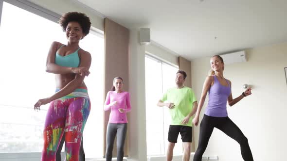Group Of Smiling People Dancing In Gym Or Studio 13 alt
