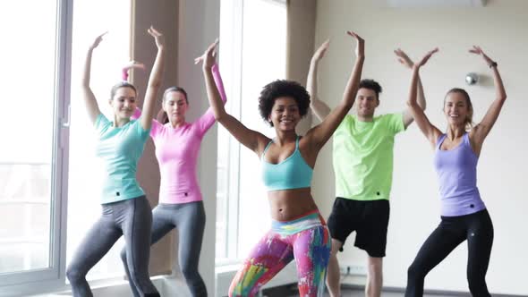 Group Of Smiling People Dancing In Gym Or Studio 3