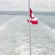 Canada Flag On Boat Leaving The Coast - VideoHive Item for Sale