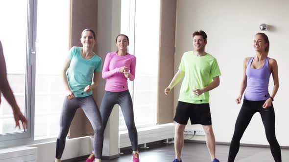 Group Of Smiling People Dancing In Gym Or Studio 5 alt