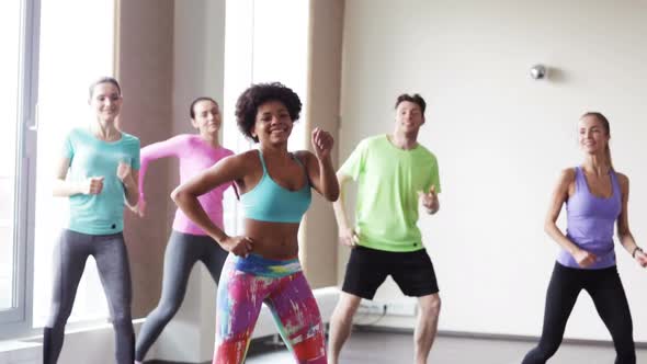 Group Of Smiling People Dancing In Gym Or Studio 7