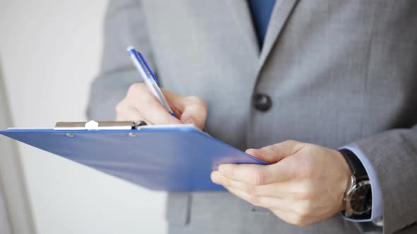 Close Up Of Man With Business Scheme And Clipboard 4 alt