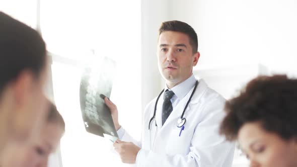 Doctor With X-Ray And Group Of Medics At Hospital 1