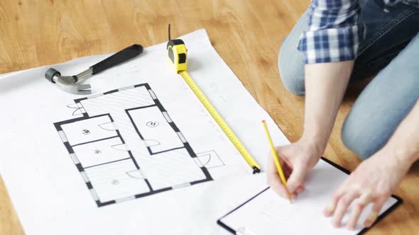 Close Up Of Male Hands Measuring Blueprint 3 alt