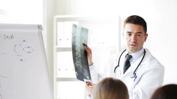 Doctor With X-Ray And Group Of Medics At Hospital 3 alt