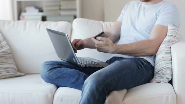 Close Up Of Man With Laptop And Credit Card 1