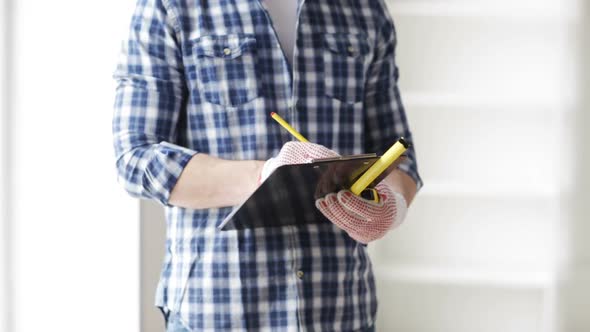 Close Up Of Man With Measuring Ruler And Clipboard 1