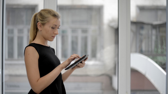 Girl Scrolling on Tab