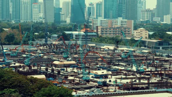 Panoramic view of cityscape and construction site in metropolis