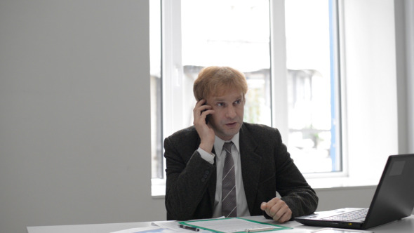 Businessman Talking on Phone
