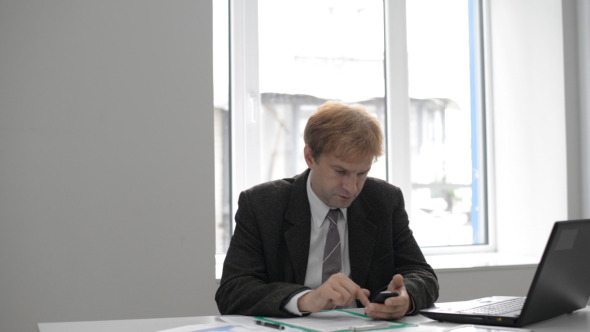 Businessman Using Phone