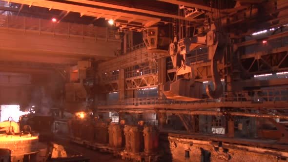 Crane is Transporting Steel Vessels Metal Becomes