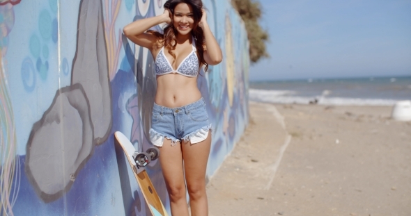 Joyful Girl Standing On The Beach