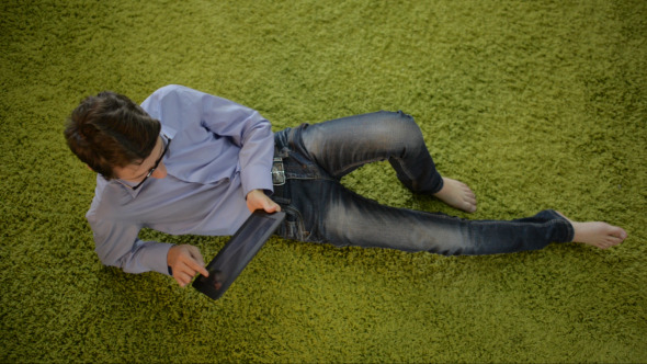 Laying on Carpet, Using Tablet alt