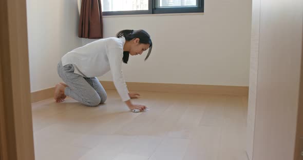 Asian Housewife woman wash the floor with rag