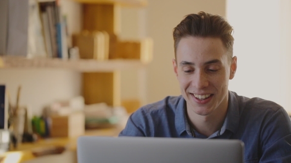 A Young Man Talking On a Conference Call