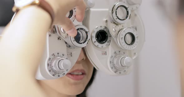 Woman Is Visiting Oculist in Clinic