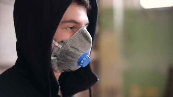 guy in a respirator and a black hood