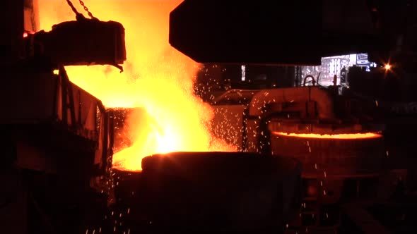 Boiling Metal in Steel Vessel Orange Light Smoke