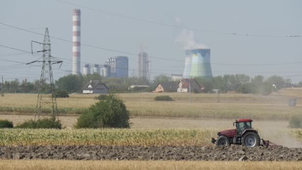 Tractor is Driven by the Fiels Landscape Dry alt