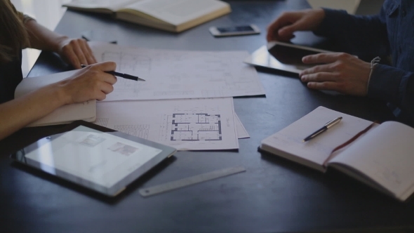 Architect Woman And Her Client Is a Man Sitting At