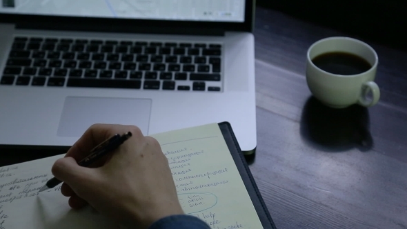 Man Studying Russian Sitting At a Laptop