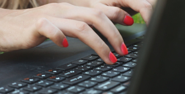 Girl Typing on a Laptop  alt