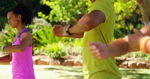 Group of people exercising in the park 4k