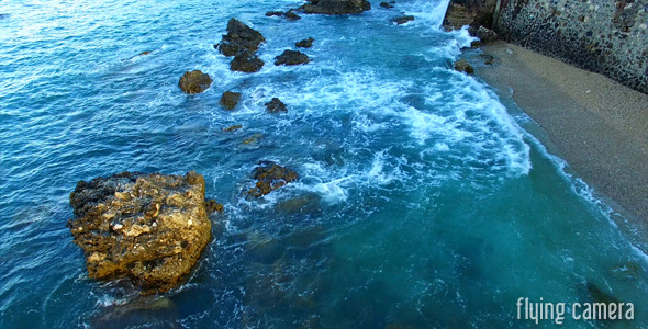 Flying Above The Waves And Rocks