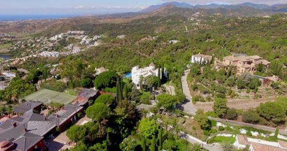 Aerial. Flight Over Houses And Trees In Andalucia