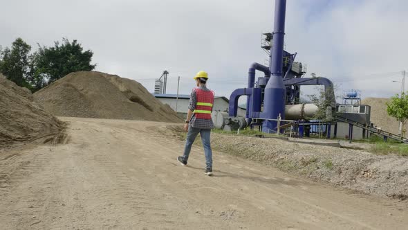 Construction Worker Walking At Construction Site