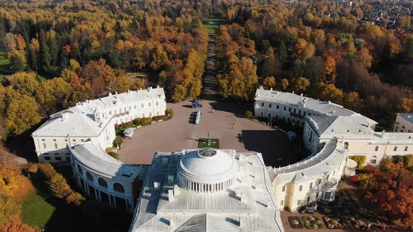 White Building of Pavlovsk Palace Among Large Autumn Park