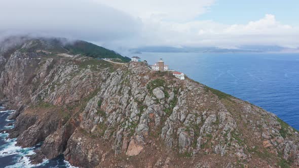 Drone Aerial Eis fly above Finisterre Lighthouse in Fisterra, Galicia, North of Spain, top notch vie