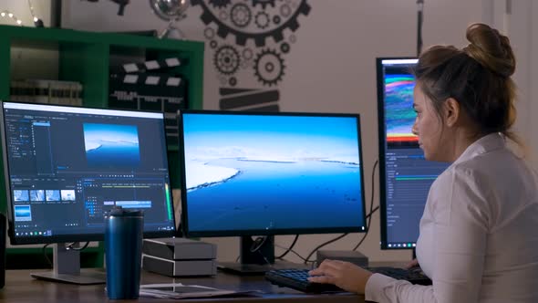 Woman Editing Video on Computer 