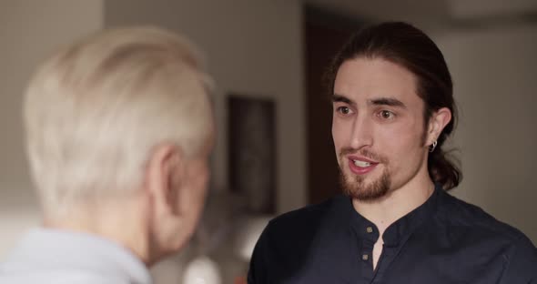 Son Talking with Father During Visit