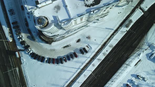 City quarters. Multi-story houses. Winter cityscape. Flight with a camera turn. Aerial photography.