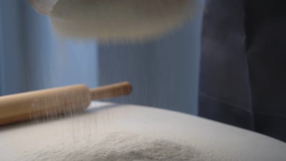 Professional Baker Hands Sift Flour Through Sieve