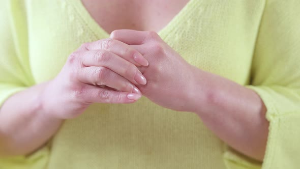 Closeup Hands of Unrecognizable Adult Caucasian Woman Taking Off Wedding Ring