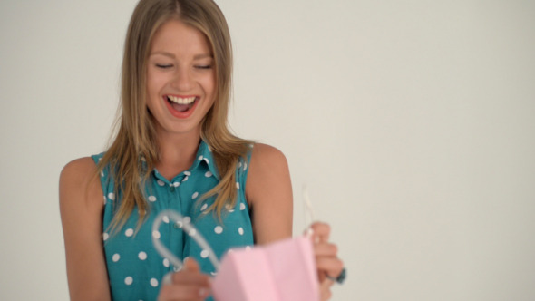 Excited Girl after Receiving Gift in Bag