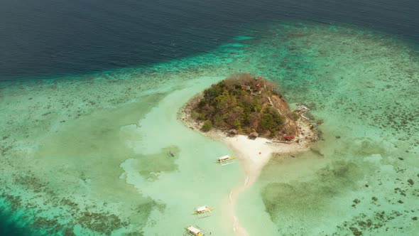 Small Torpic Island with a White Sandy Beach Top View