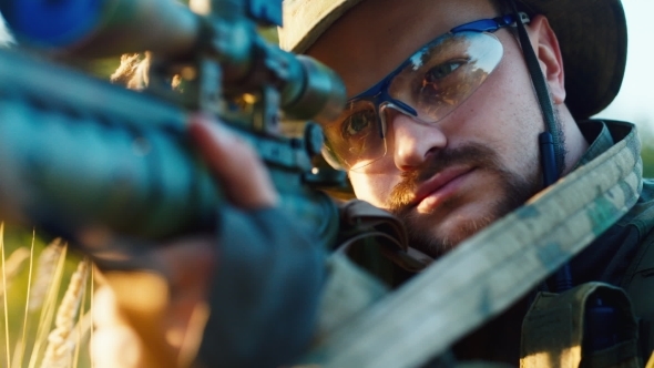 Airsoft Player Taking Aim Close-up alt