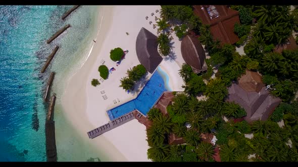 Aerial drone shot abstract of idyllic island beach trip by blue lagoon and white sandy background of