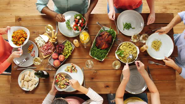 Group of People Eating at Table with Food 14