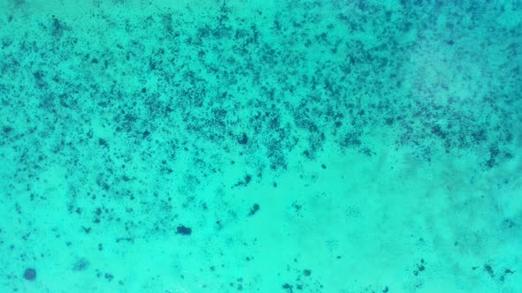 Beautiful overhead copy space shot of a sunshine white sandy paradise beach and blue sea background 