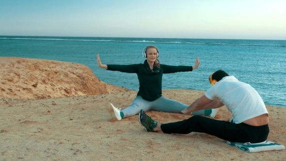 Young People Having Training On The Sea Shore