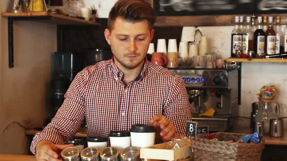 Barista Clears the Bar Counter