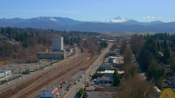 Beautiful Drone View of South Fraser Way in Abbotsford British Columbia as Traffic Moves on the Road