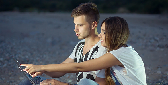 Young Couple at a Notebook