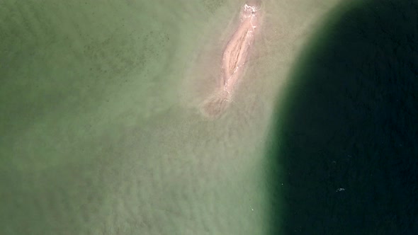 Small Uninhabited Sand Island in Ocean Reef,  Drone High Ungraded Video